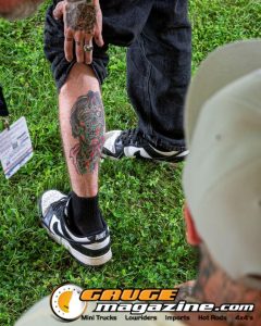 Contestants showing tattoo artwork during the Slamology 2026 Tattoo Contest on the Orion Car Audio Stage